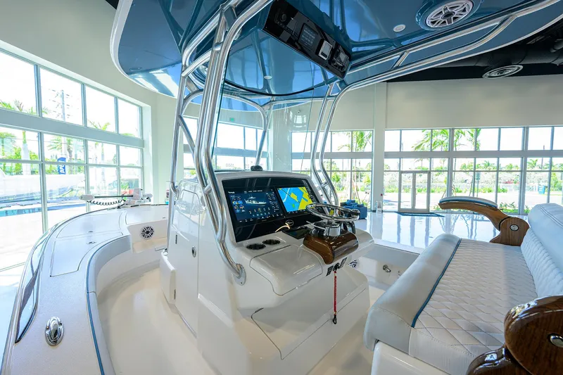 Slide: The Image of 2026 Valhalla Boatworks V-28 interior with modern helm and luxurious seating. - 13