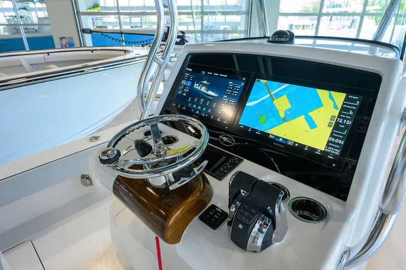 Slide: The Image of 2026 Valhalla Boatworks V-28 helm with advanced navigation displays and controls. - 16