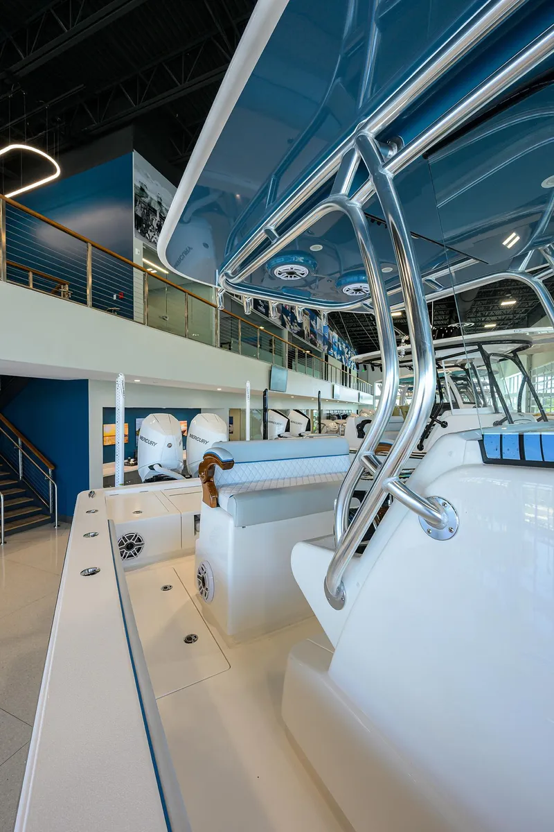 Slide: The Image of 2026 Valhalla Boatworks V-28 interior, showcasing sleek design and modern features in a showroom setting. - 18