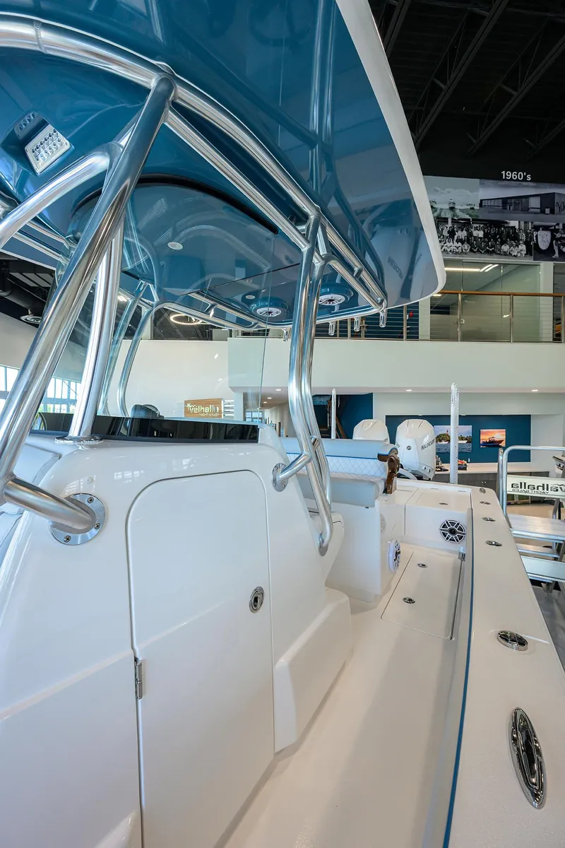 Slide: The Image of 2026 Valhalla Boatworks V-28 interior, showcasing sleek design and modern features in a showroom setting. - 19