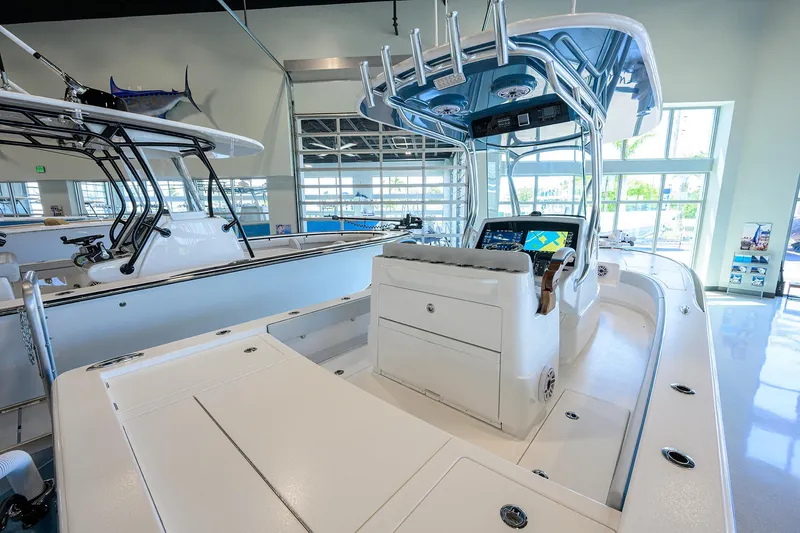 Slide: The Image of 2026 Valhalla Boatworks V-28 interior with modern console and seating in showroom. - 20
