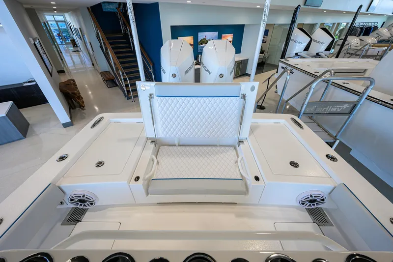 Slide: The Image of 2026 Valhalla Boatworks V-28 interior with seating and Mercury engines in showroom. - 24