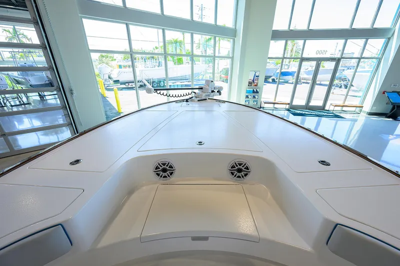 Slide: The Image of 2026 Valhalla Boatworks V-28 interior view in a showroom with large windows. - 7