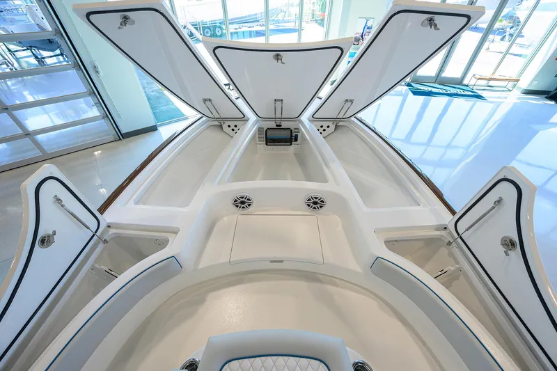 Slide: The Image of 2026 Valhalla Boatworks V-28 interior with open storage compartments and sleek design. - 9