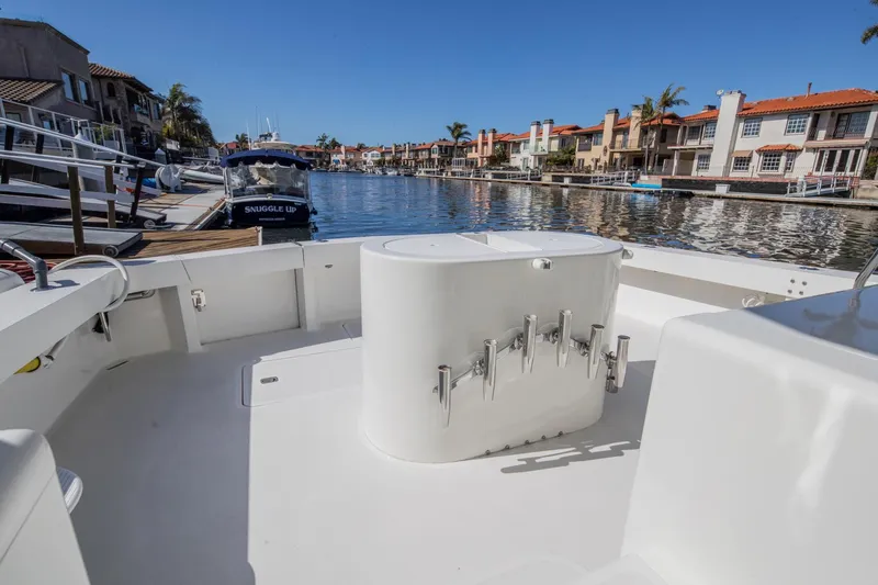 Slide: The Image of 1999 Viking 58 Enclosed Bridge yacht docked in a scenic marina. - 34