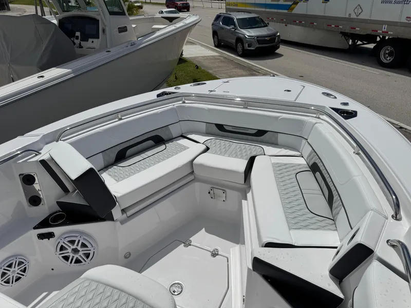 Slide: The Image of 2025 Blackfin 252 CC boat interior with luxurious seating and modern design. - 12