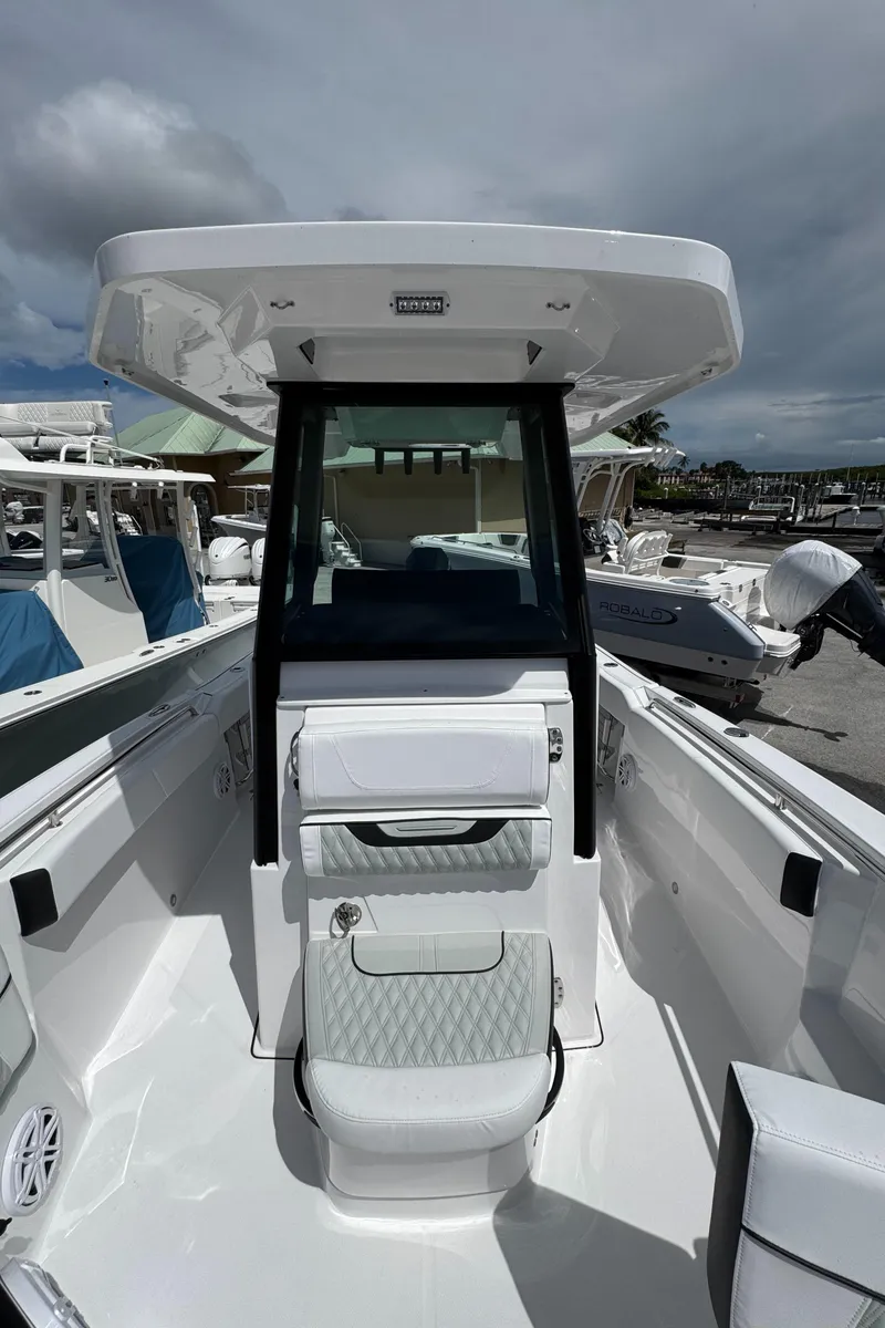 Slide: The Image of 2025 Blackfin 252 CC boat interior, featuring sleek design and modern seating. - 14