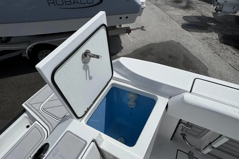 Slide: The Image of Open storage compartment on 2025 Blackfin 252 CC boat, showcasing interior design. - 8
