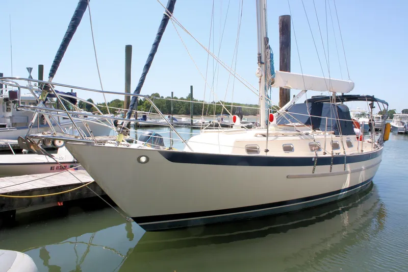 The Image of 2004 Pacific Seacraft 31 sailboat docked in a marina, side view. - 0