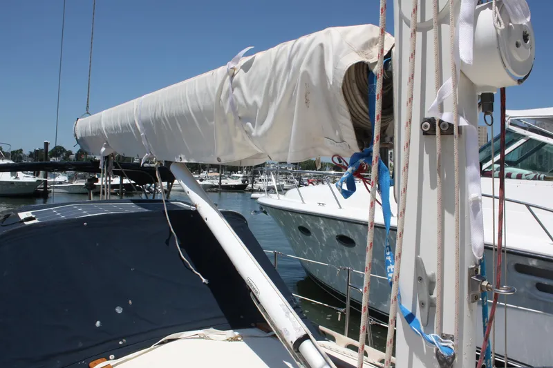 Slide: The Image of Pacific Seacraft 31 sailboat, 2004 model, docked with covered boom and rigging. - 13