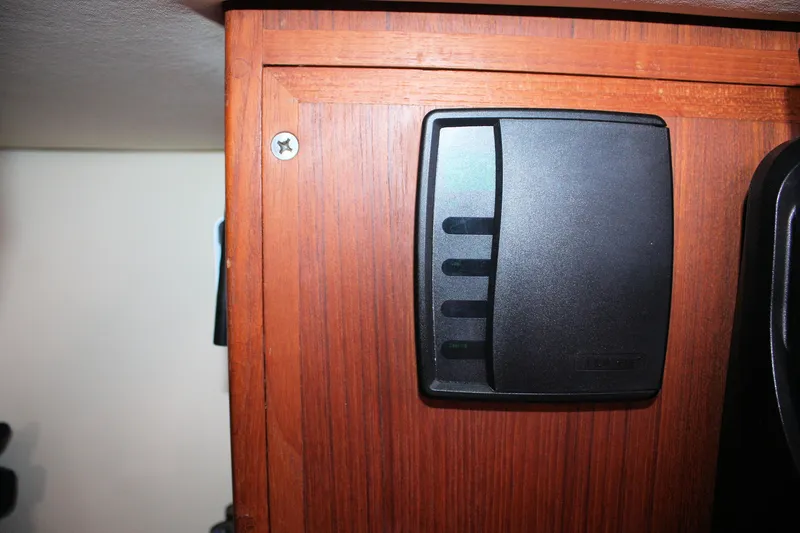 Slide: The Image of Black control panel on wooden interior of 2004 Pacific Seacraft 31 boat. - 45