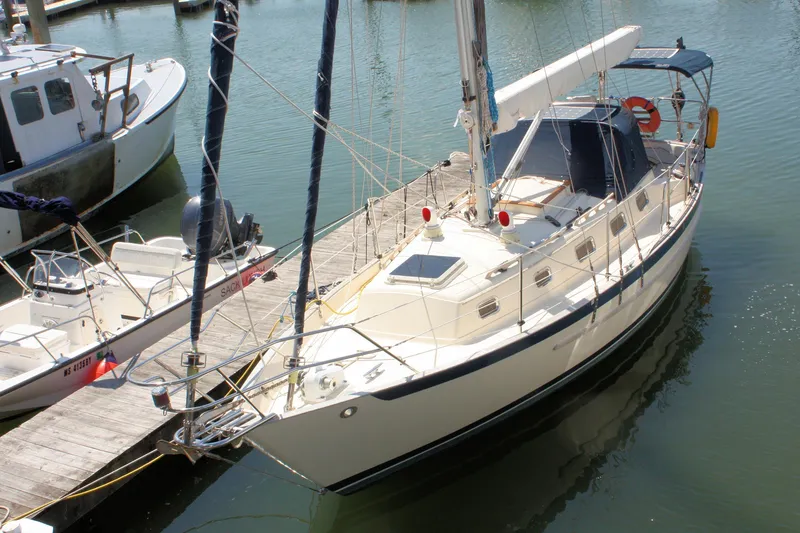 Slide: The Image of 2004 Pacific Seacraft 31 sailboat docked in a marina, viewed from above. - 5