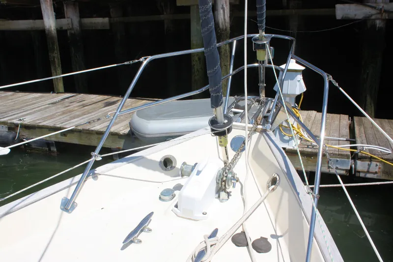 Slide: The Image of Bow of 2004 Pacific Seacraft 31 sailboat docked, featuring anchor and rigging. - 8