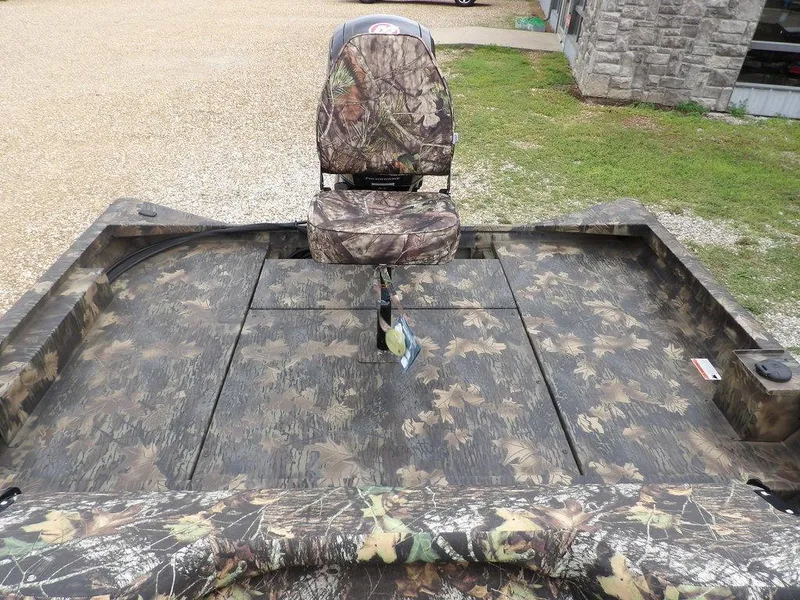 Slide: The Image of 2025 Crestliner 2070 Retriever SCHD boat with camouflage seating and deck. - 12