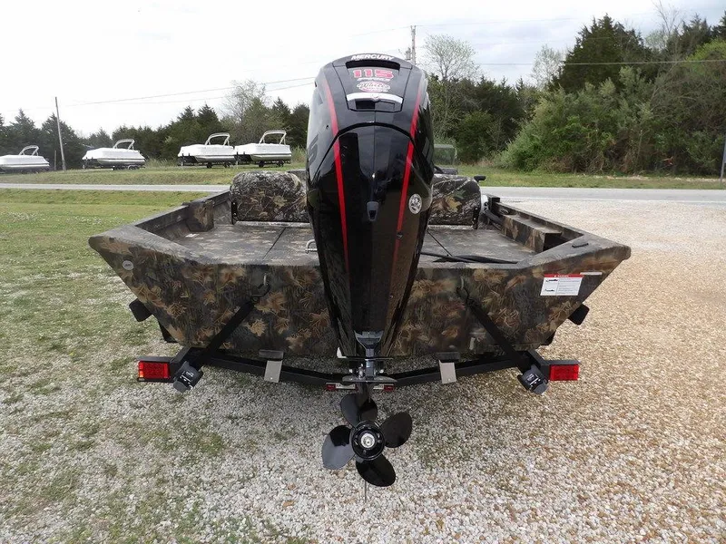 Slide: The Image of 2025 Crestliner 2070 Retriever SCHD boat with camouflage design and powerful outboard motor. - 13