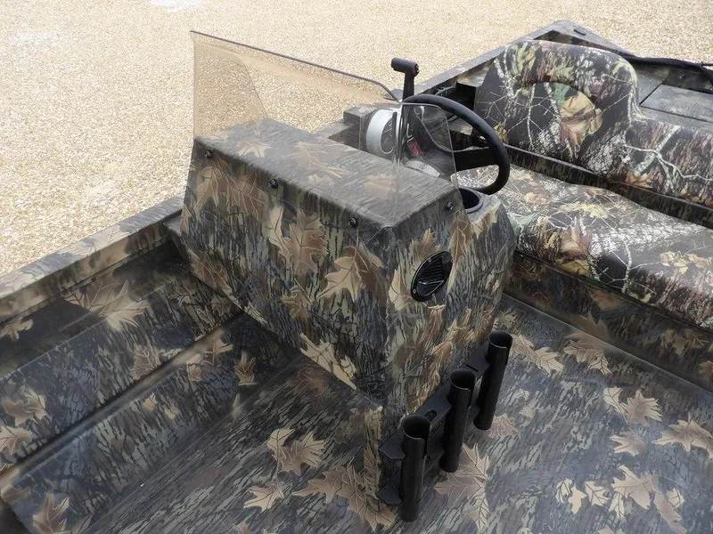 Slide: The Image of 2025 Crestliner 2070 Retriever SCHD boat with camouflage design and steering console. - 17