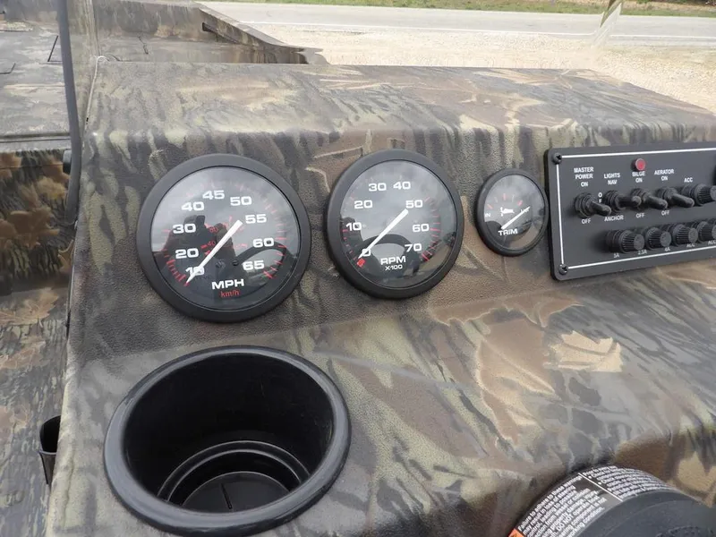 Slide: The Image of Dashboard of 2025 Crestliner 2070 Retriever SCHD with speedometer and controls. - 20