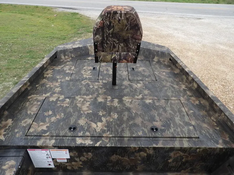 Slide: The Image of 2025 Crestliner 2070 Retriever SCHD boat with camouflage design and seating. - 23