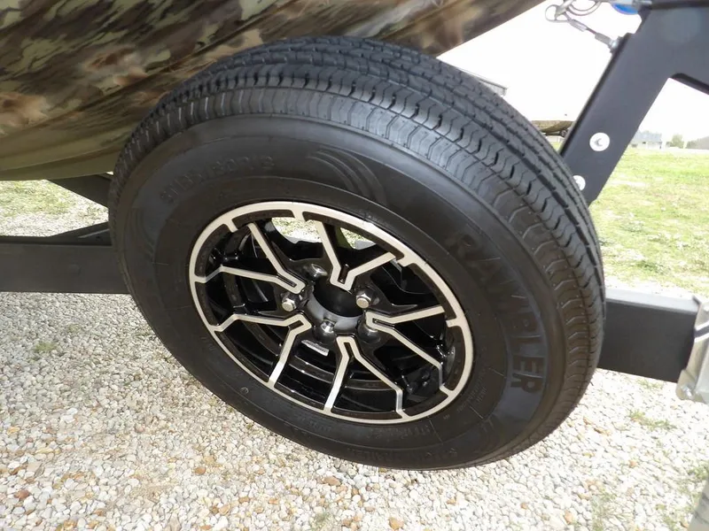 Slide: The Image of Trailer wheel of 2025 Crestliner 2070 Retriever SCHD on gravel surface. - 31