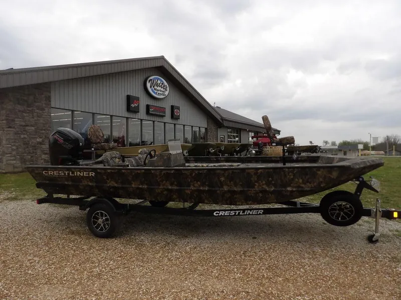 Slide: The Image of 2025 Crestliner 2070 Retriever SCHD boat on trailer outside marine center. - 5