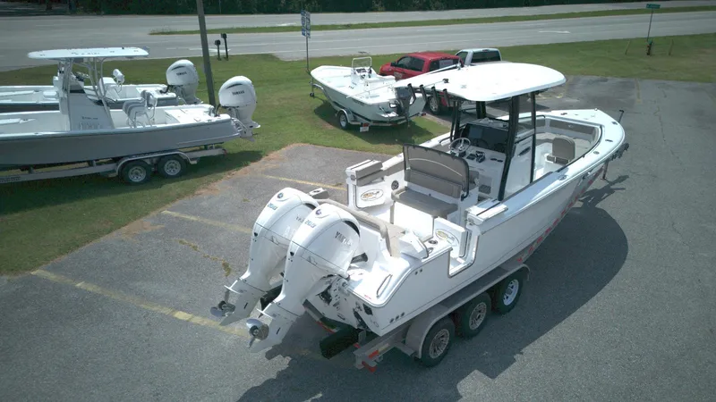 Slide: The Image of 2026 Sea Hunt Ultra 265 SE boat with dual engines on a trailer. - 3