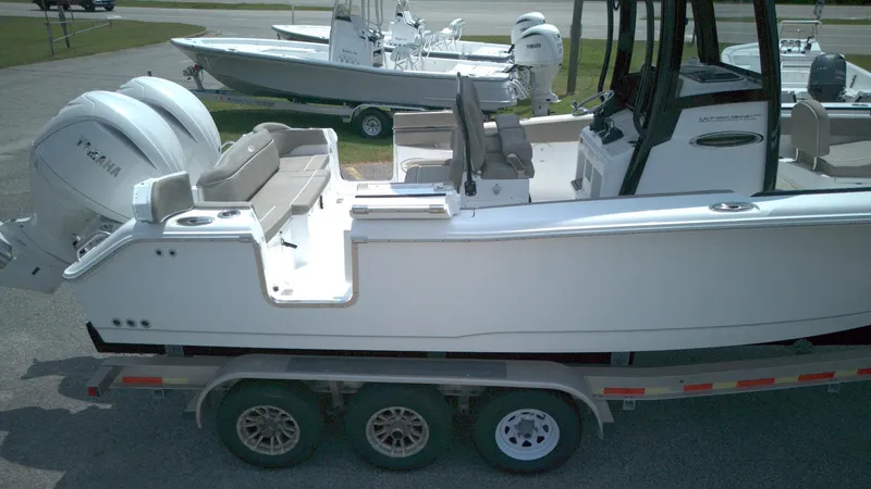 Slide: The Image of 2026 Sea Hunt Ultra 265 SE boat on trailer, side view with Yamaha engine. - 6