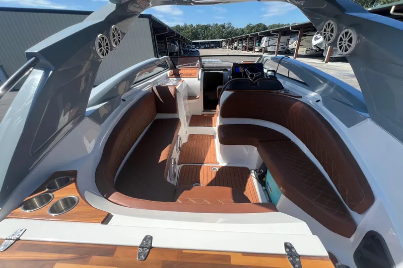 Slide: The Image of 2024 NX Boats 290 Exclusive interior with luxurious seating and modern design features. - 18