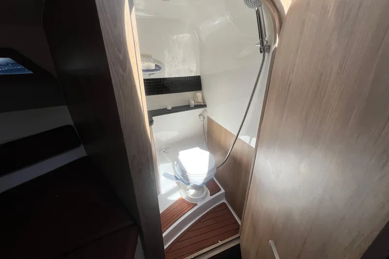 Slide: The Image of 2024 NX Boats 290 Exclusive bathroom with shower and wooden flooring. - 32