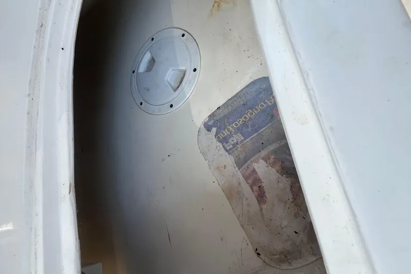 Slide: The Image of Storage compartment of 2024 NX Boats 290 Exclusive, showing interior details and hatch. - 43