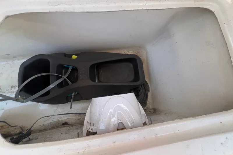 Slide: The Image of Storage compartment of 2024 NX Boats 290 Exclusive, featuring equipment and cables. - 47