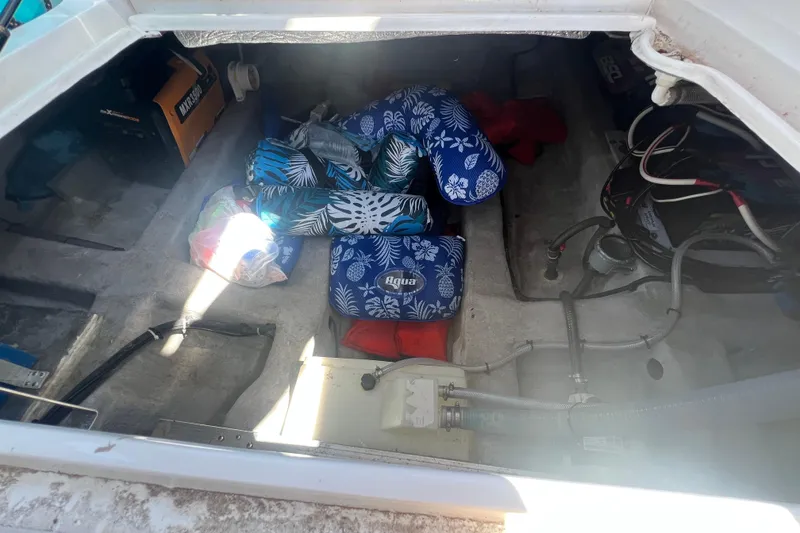 Slide: The Image of Storage compartment of 2024 NX Boats 290 Exclusive with life jackets and equipment. - 49
