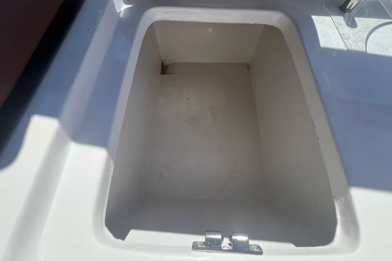 Slide: The Image of Storage compartment of 2024 NX Boats 290 Exclusive, featuring a clean, spacious interior. - 56
