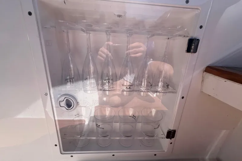 Slide: The Image of Glass storage cabinet on 2024 NX Boats 290 Exclusive yacht. - 58