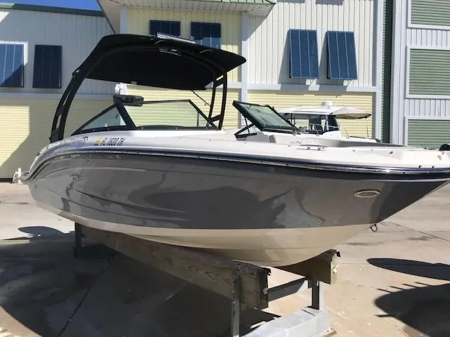 Slide: The Image of 2022 Sea Ray SPX 190 OB boat on display in a sunny marina. - 0