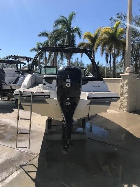 Slide: The Image of 2022 Sea Ray SPX 190 OB boat with 150 HP engine, parked outdoors. - 11