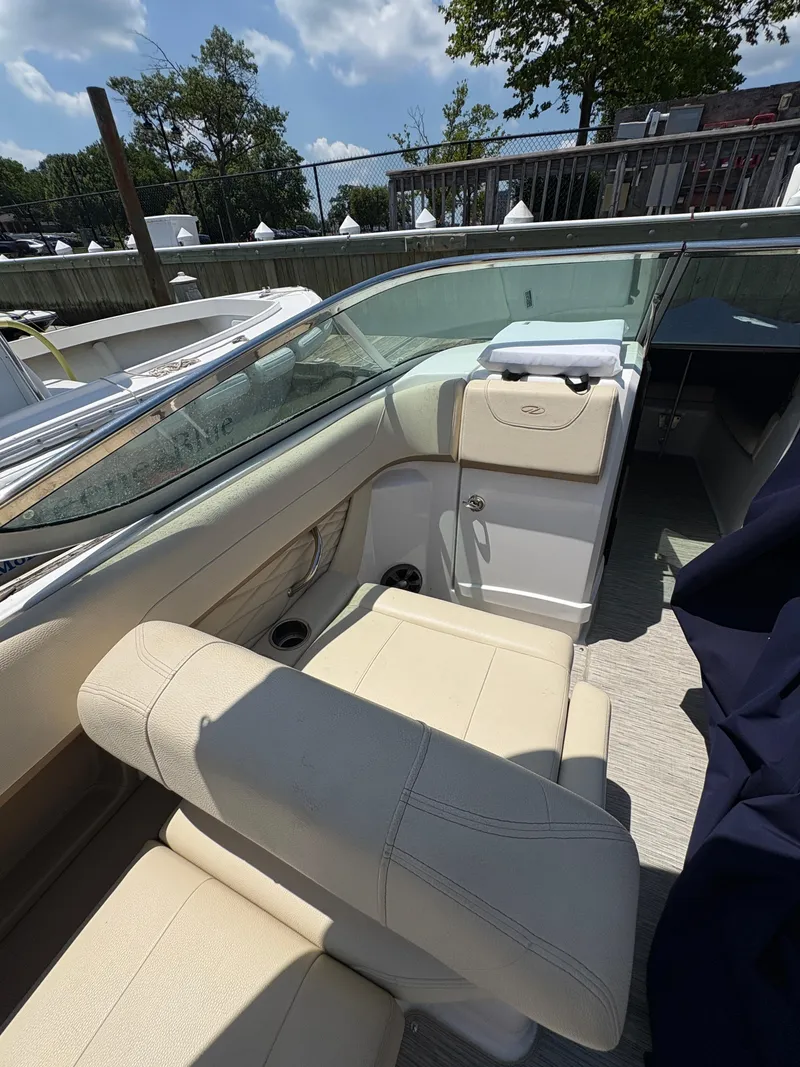 Slide: The Image of 2019 Regal 26 OBX boat interior with beige seating and sleek design. - 4
