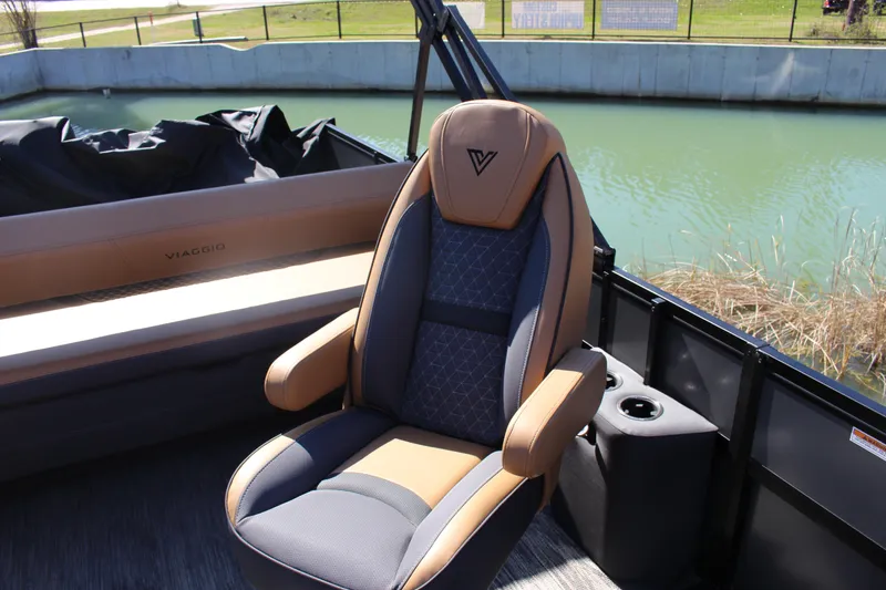Slide: The Image of Luxurious seating on 2025 Viaggio Lago Z22S CC boat by a serene waterway. - 5