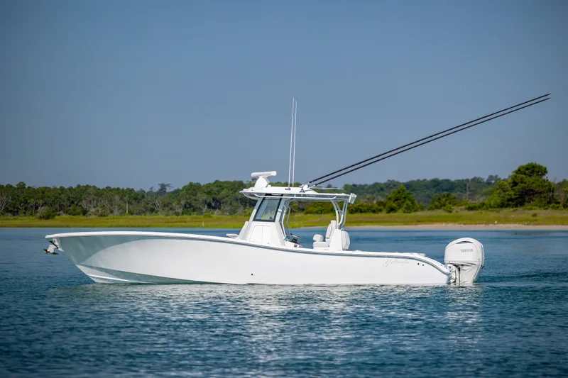The Image of 2026 Yellowfin 36 Offshore boat on calm water, side view. - 1