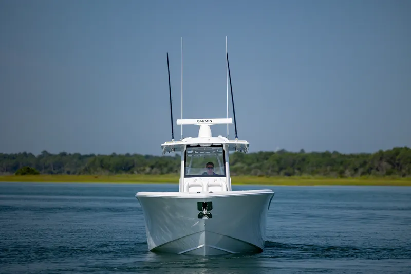 Slide: The Image of 2026 Yellowfin 36 Offshore boat cruising on calm water, clear sky background. - 10