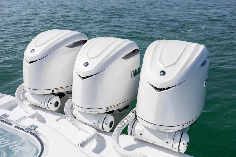 Slide: The Image of Triple Yamaha outboard engines on 2026 Yellowfin 36 Offshore boat in water. - 15