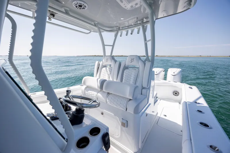 Slide: The Image of 2026 Yellowfin 36 Offshore boat interior with luxurious seating and ocean view. - 22