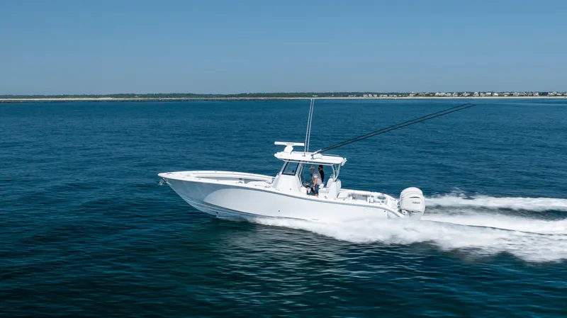 Slide: The Image of 2026 Yellowfin 36 Offshore boat cruising on open water, showcasing speed and performance. - 31