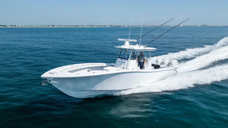 Slide: The Image of 2026 Yellowfin 36 Offshore boat cruising on open water, showcasing speed and performance. - 32