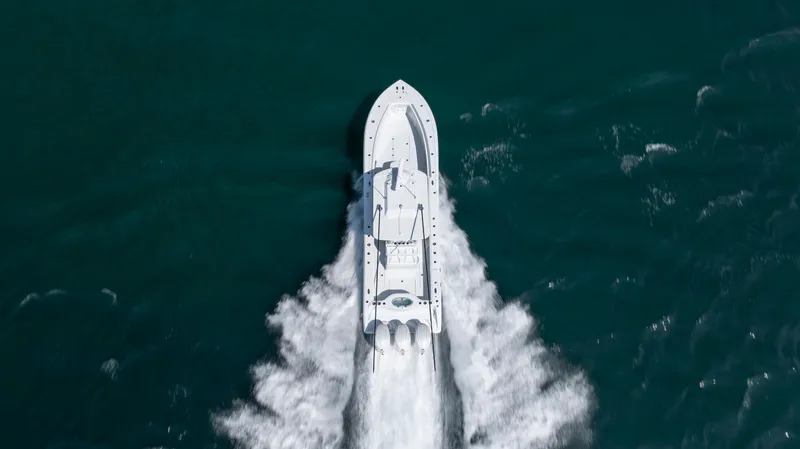 Slide: The Image of Aerial view of 2026 Yellowfin 36 Offshore boat speeding on open water. - 35