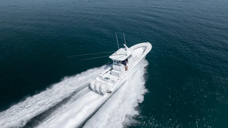 Slide: The Image of 2026 Yellowfin 36 Offshore boat cruising on open water, aerial view. - 43