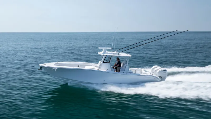 Slide: The Image of 2026 Yellowfin 36 Offshore boat cruising on open water, side view. - 44