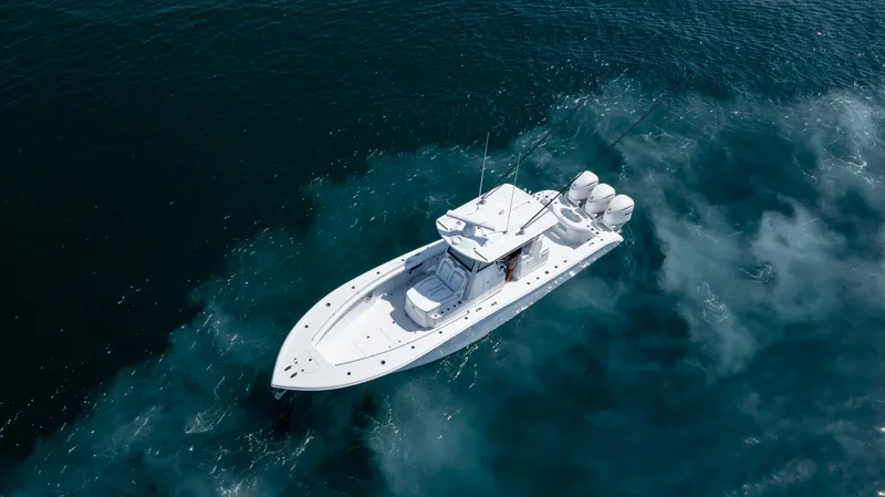 Slide: The Image of 2026 Yellowfin 36 Offshore boat cruising on open water, aerial view. - 46
