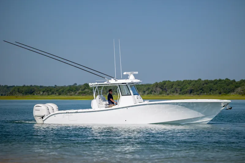 Slide: The Image of 2026 Yellowfin 36 Offshore boat cruising on calm water. - 5