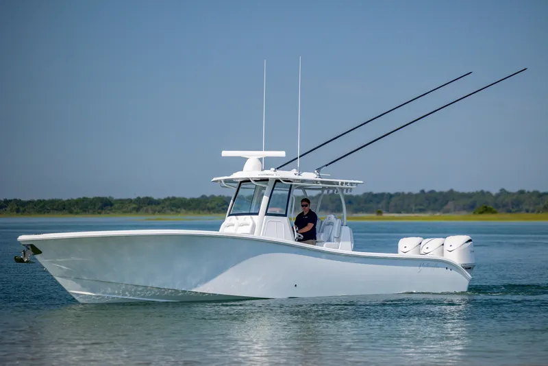 Slide: The Image of 2026 Yellowfin 36 Offshore boat cruising on calm water. - 9