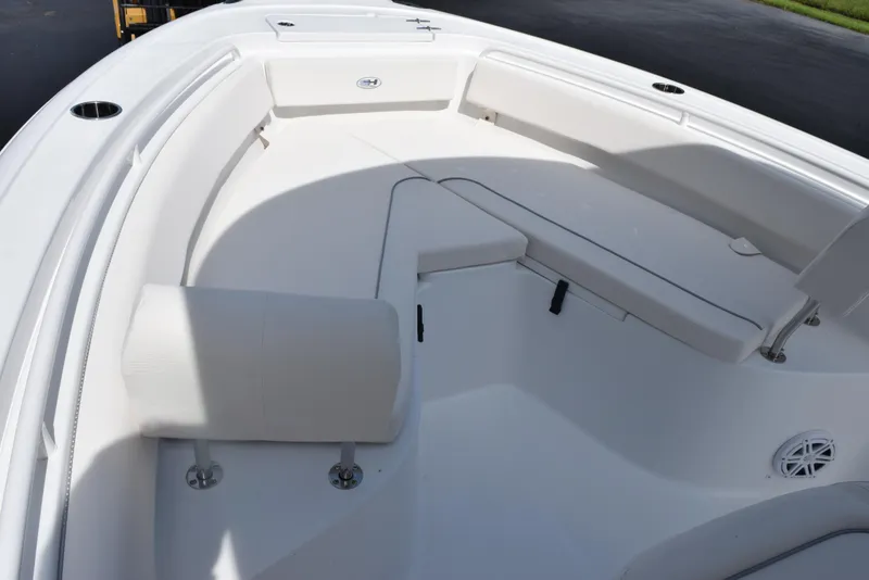 Slide: The Image of 2026 Sea Hunt Ultra 245 SE boat interior with cushioned seating and sleek design. - 12